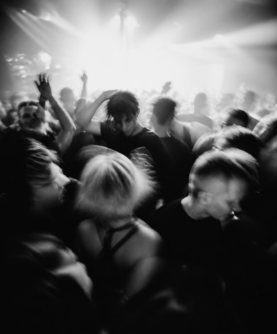 Crowd dancing under a strobe