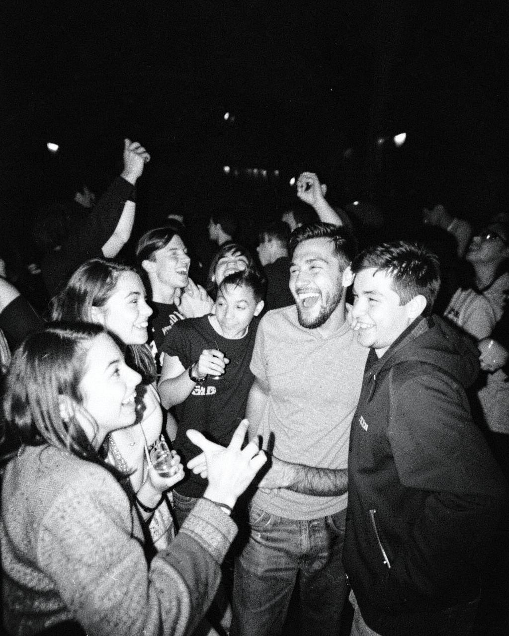 Friends laughing together at a night hangout