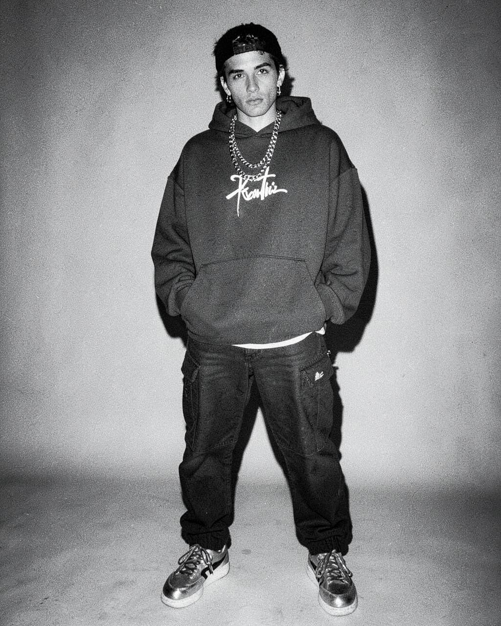 Person in streetwear standing confidently before a night out