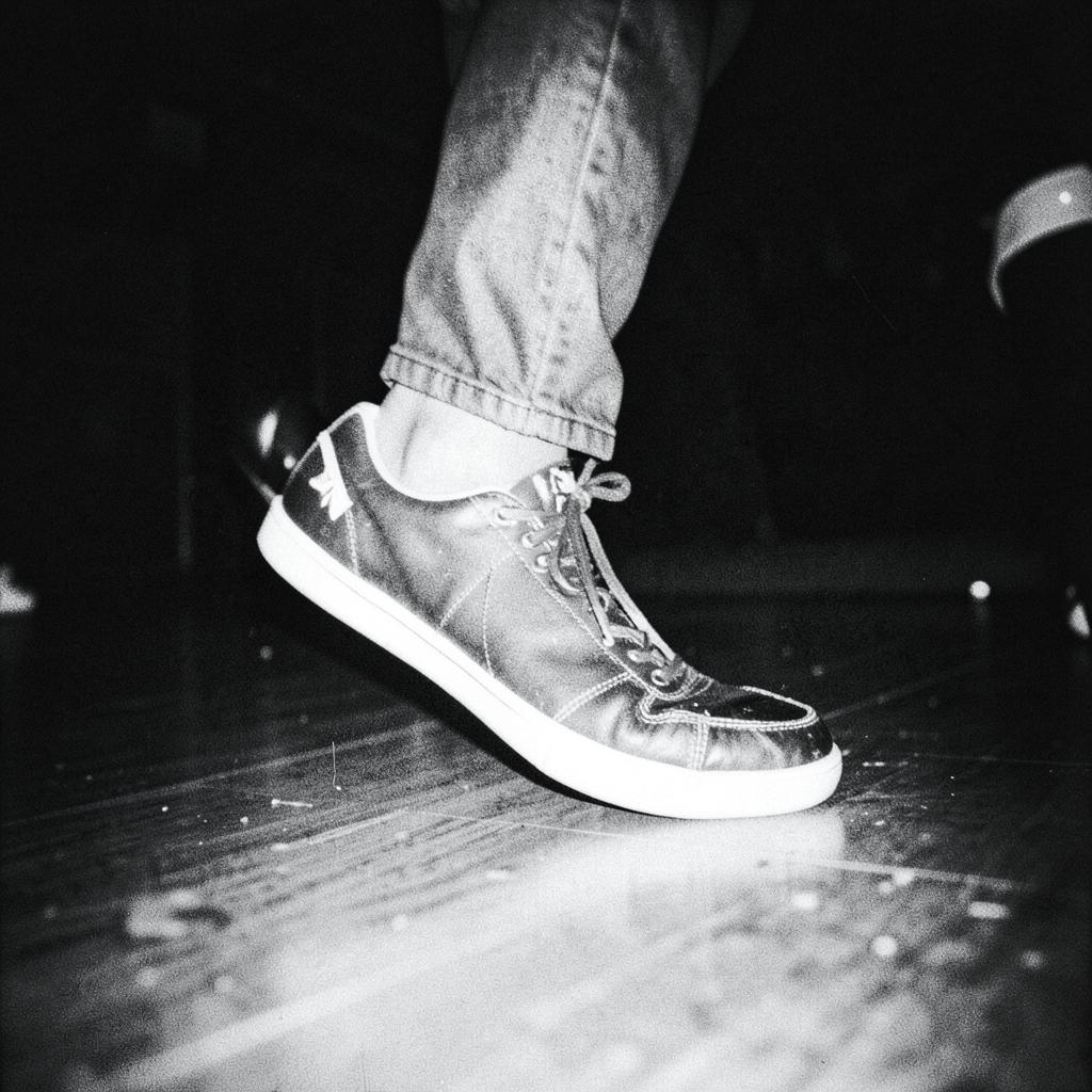 Sneakers caught mid dance move on a dance floor